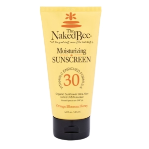 Tube of The Naked Bee Moisturizing Sunscreen SPF 30 with orange blossom honey, 55 ml/1.9 oz, on black cap.